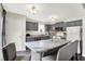 Cozy kitchen with a center island, gray cabinetry, and an abundance of natural light at 7437 Lorene Ct, Indianapolis, IN 46237