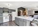Spacious open kitchen, center island with bar seating and views of a cozy Gathering room at 7437 Lorene Ct, Indianapolis, IN 46237