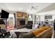 Inviting living room featuring a brick fireplace, large windows, and a comfortable seating area at 7437 Lorene Ct, Indianapolis, IN 46237