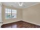 Bright bedroom featuring hardwood floors and a window for natural light at 7637 Sand Run Ct, Indianapolis, IN 46259