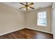 Bedroom featuring hardwood floors, ceiling fan, and a window at 7637 Sand Run Ct, Indianapolis, IN 46259