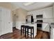 Modern kitchen featuring stainless steel appliances, white cabinets, and a breakfast bar with seating at 7637 Sand Run Ct, Indianapolis, IN 46259