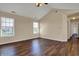 An empty living room with a staircase, wood floors, and fresh paint at 7637 Sand Run Ct, Indianapolis, IN 46259