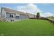 Expansive backyard featuring a well-maintained lawn and a charming deck, perfect for outdoor relaxation at 7724 Dunleer Dr, Brownsburg, IN 46112