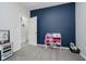 Bedroom with carpet, blue accent wall, and closet at 7724 Dunleer Dr, Brownsburg, IN 46112