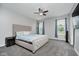 Spacious bedroom featuring a neutral color scheme, carpet, and a large window for natural light at 7724 Dunleer Dr, Brownsburg, IN 46112