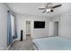 Bedroom with a ceiling fan, gray walls, carpet, and two windows at 7724 Dunleer Dr, Brownsburg, IN 46112