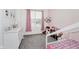 Cozy bedroom with a dresser, decorations, and natural light from a window at 7724 Dunleer Dr, Brownsburg, IN 46112