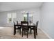 Bright dining area featuring a wooden table with seating and natural light from windows at 7724 Dunleer Dr, Brownsburg, IN 46112