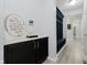 Hallway featuring modern decor, a built-in hall tree, and stylish design elements at 7724 Dunleer Dr, Brownsburg, IN 46112