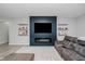 Well-lit living room with fireplace and TV, with contemporary decor at 7724 Dunleer Dr, Brownsburg, IN 46112