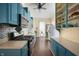 Charming kitchen with blue cabinets, modern appliances, and a spacious layout at 8 W Jackson St, Knightstown, IN 46148