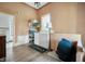 Practical laundry room with a washer, dryer, and vintage wooden floors at 8 W Jackson St, Knightstown, IN 46148