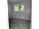 Cozy bedroom with new flooring and natural light streaming through the window at 8109 E Penway St, Indianapolis, IN 46226