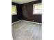 Bedroom with new flooring and windows, with black walls at 8109 E Penway St, Indianapolis, IN 46226