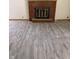 Bright living room featuring a brick fireplace and neutral flooring with a wooden trim at 8109 E Penway St, Indianapolis, IN 46226