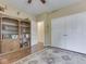 Bedroom features wood floors, a bookcase, and double closets at 811 Gazebo Way, Greenwood, IN 46142