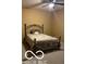 Cozy bedroom with neutral colors, carpeted floors, and a decorative metal bed frame at 811 Gazebo Way, Greenwood, IN 46142