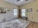 Bedroom with windows, wood floors, and decoratively patterned rug at 811 Gazebo Way, Greenwood, IN 46142