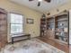 Neutral bedroom featuring hardwood floors, a built-in bookcase, and natural light from the window at 811 Gazebo Way, Greenwood, IN 46142