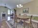 Dining room with area rug, fireplace, and lots of light at 811 Gazebo Way, Greenwood, IN 46142