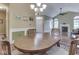 Dining room featuring chandelier lighting, a table, and front entryway at 811 Gazebo Way, Greenwood, IN 46142