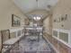 Elegant dining room with beautiful rug and adjacent kitchen at 811 Gazebo Way, Greenwood, IN 46142
