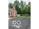 A well-maintained home featuring a brick chimney, manicured lawn, and tasteful landscaping at 811 Gazebo Way, Greenwood, IN 46142