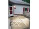 Inviting entrance featuring a red door, red shutters, and a cozy outdoor patio space at 811 Gazebo Way, Greenwood, IN 46142