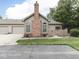 Charming home exterior with a brick chimney and a well-maintained lawn at 811 Gazebo Way, Greenwood, IN 46142