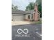 The property showcases a well-maintained exterior with a two-car garage and mature landscaping at 811 Gazebo Way, Greenwood, IN 46142