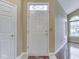 Bright foyer with a decorative glass window above the front door and hardwood floors at 811 Gazebo Way, Greenwood, IN 46142