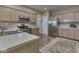 Kitchen featuring stainless steel appliances, updated cabinetry, and luxury flooring at 811 Gazebo Way, Greenwood, IN 46142