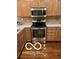 Well-equipped kitchen featuring stainless steel appliances and light wood cabinets at 811 Gazebo Way, Greenwood, IN 46142