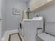 Bright laundry room with white washer and dryer, storage cabinets, and neutral decor at 811 Gazebo Way, Greenwood, IN 46142