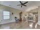 Open-concept living room with hardwood floors, a fireplace, and a view of the dining area at 811 Gazebo Way, Greenwood, IN 46142