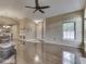 Bright living room with hardwood floors, ceiling fan, and neutral color palette at 811 Gazebo Way, Greenwood, IN 46142