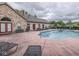 Outdoor pool with sun loungers and building in the background on a cloudy day at 811 Gazebo Way, Greenwood, IN 46142