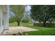 Private backyard features a patio and a fire pit overlooking the pond at 8121 Sand Ridge Cir, Indianapolis, IN 46237