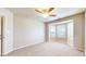 Carpeted bedroom with a ceiling fan and bay windows for ample natural light at 8121 Sand Ridge Cir, Indianapolis, IN 46237
