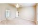 Neutral bedroom with carpeted floors leads to a full ensuite bathroom at 8121 Sand Ridge Cir, Indianapolis, IN 46237