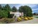 Welcome to Southern Ridge, a Beazer Homes community, beautifully landscaped with vibrant yellow flowers at 8121 Sand Ridge Cir, Indianapolis, IN 46237
