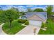 Aerial view showing the home's well-manicured lawn and two car garage at 8121 Sand Ridge Cir, Indianapolis, IN 46237
