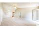 Large living room featuring neutral carpeting, vaulted ceilings, and ceiling fan at 8121 Sand Ridge Cir, Indianapolis, IN 46237