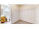 Walk-in closet with carpet, wire shelving, and a view to the ensuite bathroom at 8121 Sand Ridge Cir, Indianapolis, IN 46237