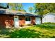 Charming single-story brick home with well-manicured lawn and attached garage at 8744 Montery Ct, Indianapolis, IN 46226