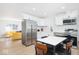 Modern kitchen features stainless steel appliances, white cabinets, and quartz countertops at 8744 Montery Ct, Indianapolis, IN 46226