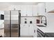 Modern kitchen features stainless steel appliances, white cabinets, and quartz countertops at 8744 Montery Ct, Indianapolis, IN 46226
