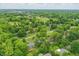 Beautiful aerial view of the neighborhood, showcasing mature trees and lush landscaping at 8752 Washington Blvd E Dr, Indianapolis, IN 46240