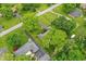 Expansive aerial view of a lush neighborhood with mature trees and well-maintained lawns and diverse home styles at 8752 Washington Blvd E Dr, Indianapolis, IN 46240